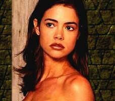 Denise Richards as The Sacred Twins